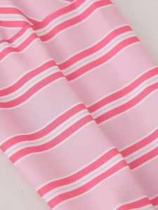 Close-up detail of the pink and white striped fabric texture on this summer fashion set