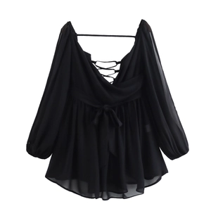 Detailed view of black V-neck chiffon mini dress with lantern sleeves and lace-up front