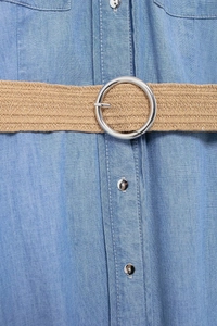 Detail of light blue denim dress featuring a woven stretch belt with silver metal ring