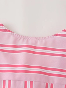 Detail view of pink and white striped shirt neckline with fine stitching quality