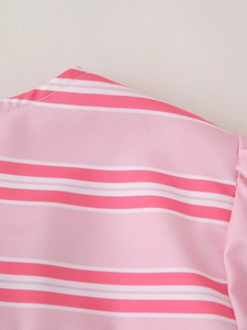 Detail shot of pink and white striped fabric showing fine stitching and soft texture