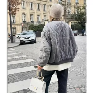 Women's grey quilted bomber jacket in a loose fit, casual autumn street style