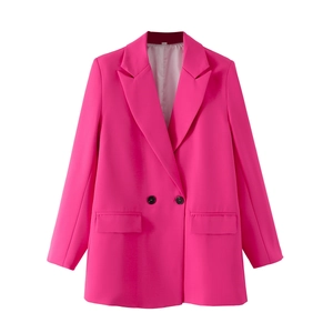 Detail view of fuchsia oversized blazer featuring notched lapels and two black buttons