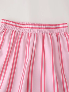 Detail of elastic waist on pink and white vertical striped summer shirt and shorts set