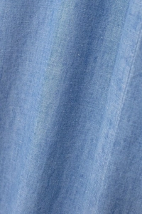 Close-up of premium light blue linen fabric texture with natural weave and soft folds