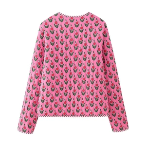 Women's pink floral quilted jacket featuring vintage flower prints and striped edging