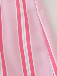 Close-up detail of pink and white vertical stripe fabric texture for summer set