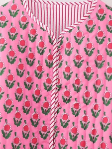 Detail of floral block print quilted cotton vest with striped binding and fabric buttons