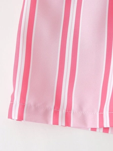 Close-up of pink and white striped fabric showing stitching and smooth texture