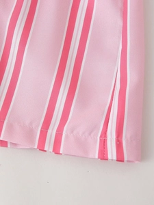 Detail view of pink and white vertical stripes on cotton fabric with neat stitching