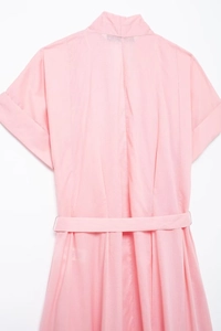 Detail of pink short sleeve shirt dress featuring a stand collar and matching waist belt