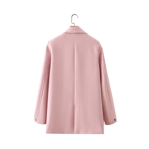 Detail shot of the pink blazer back vent and sleeve buttons with premium fabric texture