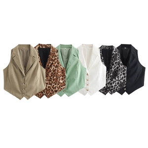 Flat lay detail showing six varied colors and leopard patterns of V-neck suit vests