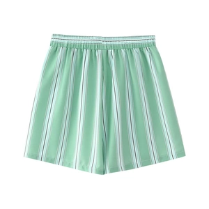 Detailed view of mint green and white vertical striped casual shorts with elastic waistband