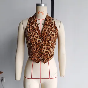 Detail of leopard print vest featuring a notch lapel and a front five-button closure