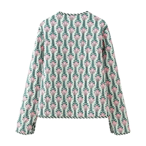 Detailed back view of cropped cotton jacket featuring floral prints and striped ribbed trim