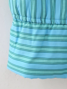 Macro shot of blue striped cotton fabric with detailed smocked elastic texture