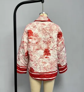 Detail of white quilted jacket with red Toile de Jouy tiger print and striped cuffs