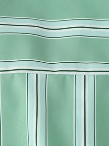 Detailed view of green striped fabric stitching and high-quality woven textile texture