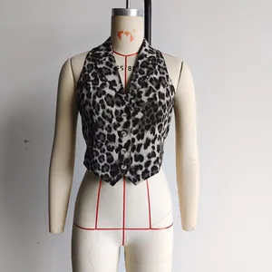 Close-up of leopard print vest featuring a lapel collar and elegant pearl buttons
