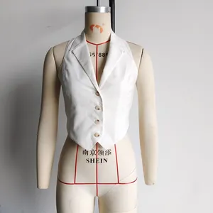 Detailed close-up of a white halter neck vest featuring a V-neck lapel and yellow buttons