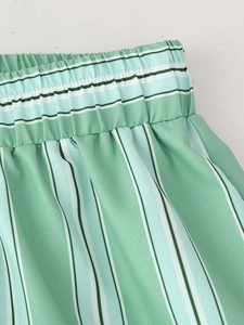 Detail of elastic waistband and mint green striped woven fabric on summer set
