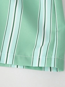 Macro detail of the vertical striped hem with precise single-needle stitching and texture