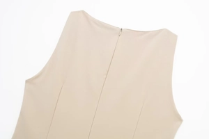 Close-up of the beige sleeveless dress featuring a seamless back invisible zipper