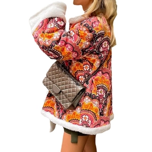 Women's bohemian print quilted jacket with white faux fur trim and colorful floral patterns