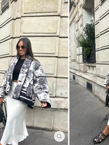 Detail of printed jacket with black and white Toile de Jouy pattern and front pockets