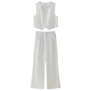Women's white two-piece set featuring a V-neck vest and high-waist wide-leg trousers