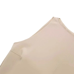 Elegant beige sleeveless dress featuring clean shoulder stitching and high-quality fabric texture
