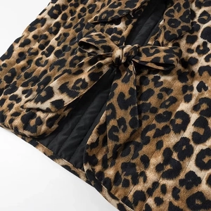 Women's corduroy leopard print vest with front bow tie closure and quilted lining