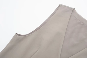 Detailed close-up showing reinforced seams and stitching of the light grey slim-fit vest