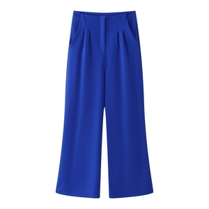 Detail of high-waisted royal blue wide-leg trousers with front pleats and side pockets