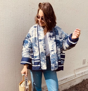 Detailed view of quilted cotton jacket featuring vintage blue and white floral prints