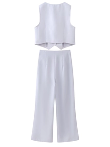 Back view of high-waist wide-leg trousers and cropped vest set in light purple fabric