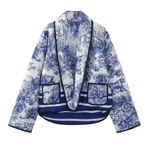Detail showing the Toile de Jouy tiger print and quilted fabric texture with dual pockets