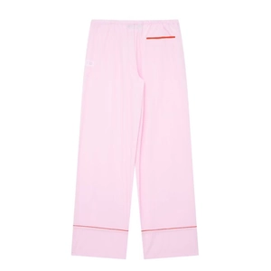 Pantalon de pyjama en popeline rose avec taille élastique et détails passepoilés rouges