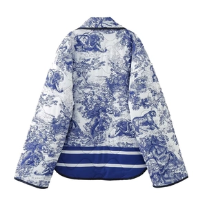 Back view of quilted cotton jacket featuring blue Toile de Jouy wildlife animal prints
