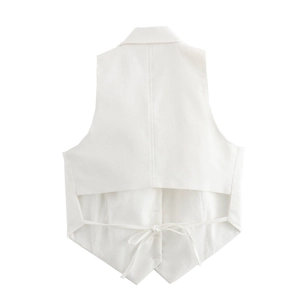 Detail view of white backless vest featuring elegant string tie bow and tailored fabric