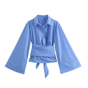 Women's light blue poplin shirt featuring wide flared sleeves and a belted waist design