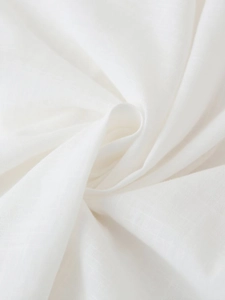 Macro view of white linen textile fabric texture with natural fiber weave and soft folds