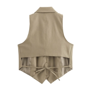 Detail of khaki tie-back vest showing layered cut-out design and adjustable waist tie