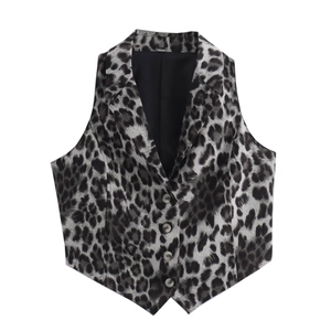 Detail of leopard print vest showing fabric texture, lapel collar, and buttons