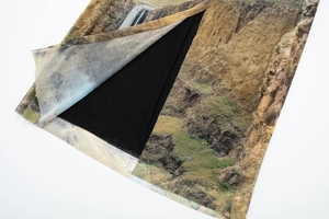 Detail of landscape print mesh fabric with inner black lining and double-layer design