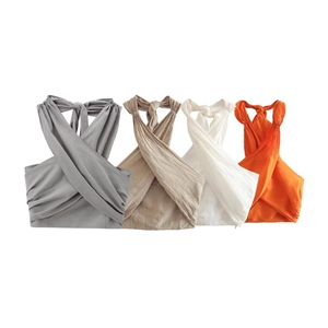 Detail of summer halter linen crop tops in gray, beige, white and orange colors