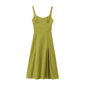 Detail view of grass green linen maxi dress featuring ruched bust and side slit