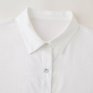 White linen shirt for women with embroidered sleeves and classic button collar detail