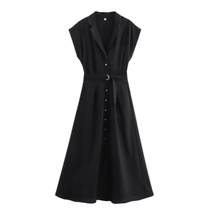 Detail of black V-neck sleeveless shirt dress with gold buttons and belted waist